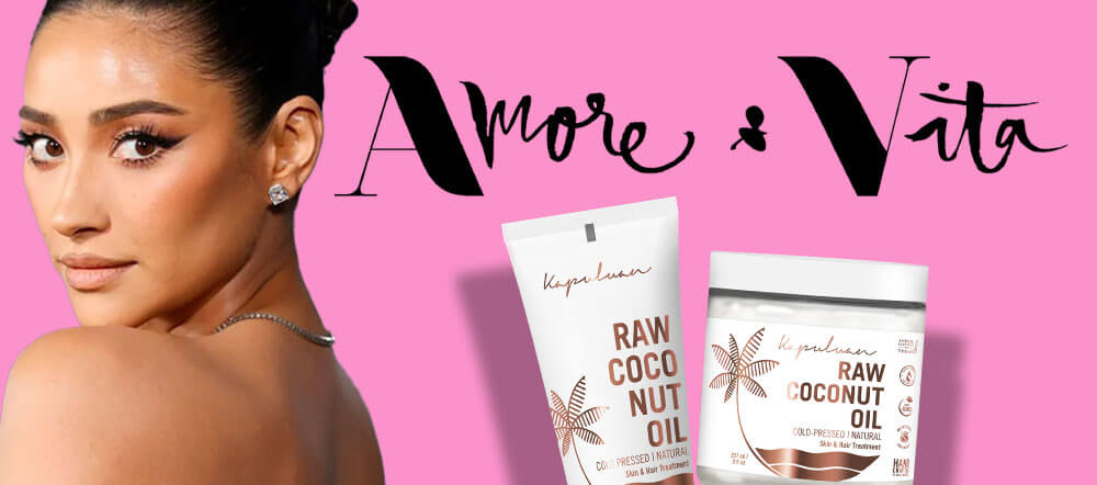 Promotional image featuring a woman with a side profile, set against a pink background, alongside two products, raw coco oil and coconut scrub, with the text "amore vita" stylishly displayed above.