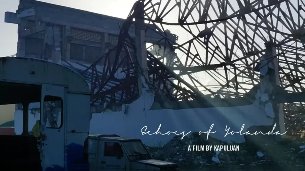 A partially collapsed building with bent steel structures and rubble is bathed in sunlight. A damaged vehicle is visible in the foreground. The text on the image reads "Echoes of Yolanda, A Film by Kapuluan.