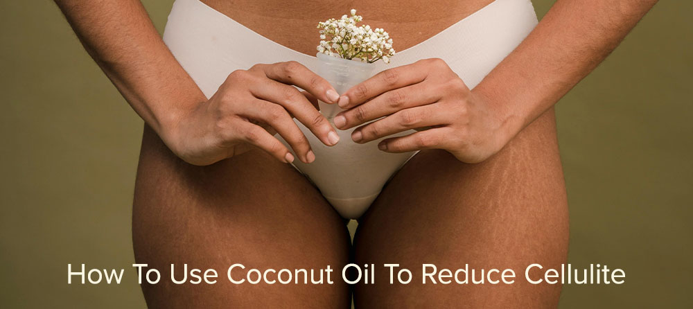 Image shows a person wearing beige underwear, holding a small bouquet of white flowers in front of their pelvis. The background is a muted olive green. The text at the bottom reads, "How To Use Coconut Oil To Reduce Cellulite.