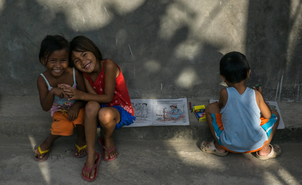 Happy kids of Lingap Center with their colouring books