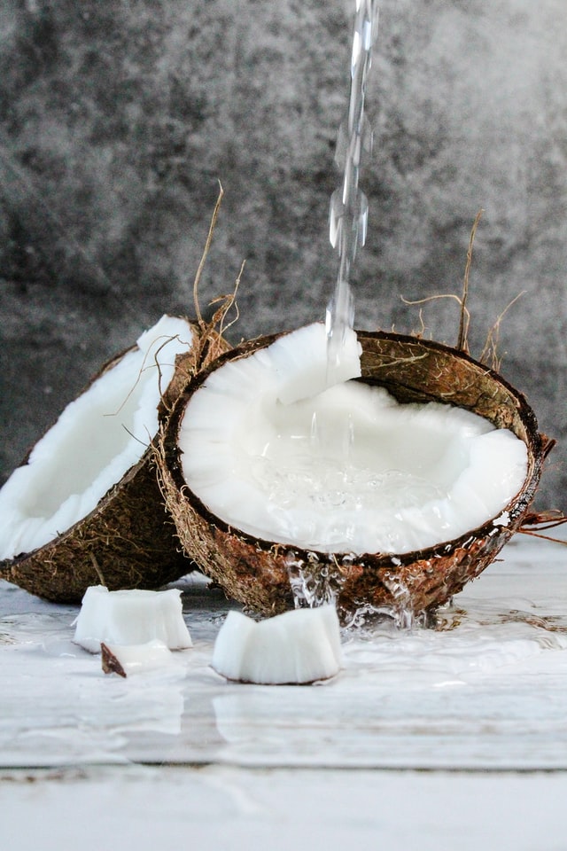 coconut oil with water pouring over it.