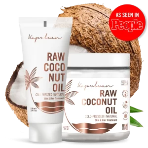 Image of two Cold-Pressed Raw Coconut Oil skin and hair treatment products in front of a cracked coconut. One is a 100 mL tube, and the other is a 237 mL jar. There is also a red circle with the text "As Seen in People" on the top right, showcasing their premium raw coconut oil benefits.
