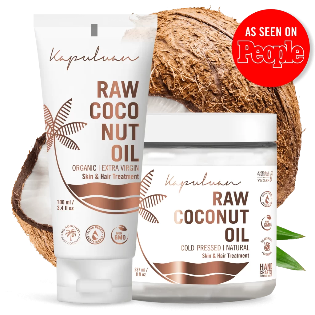 Two Kapuluan Raw Coconut Oil products are displayed in front of a coconut. On the left is a tube labeled "Organic | Extra Virgin," and on the right, a jar marked "Cold-Pressed Raw Coconut Oil." A red "As Seen On People" badge adorns the corner, emphasizing the appeal of raw coconut oil.