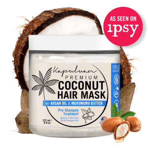 A jar of Coconut Hair Mask w/ Argan and Murumuru by Kapuluan is displayed in front of a split coconut, with text indicating its feature on Ipsy. The hair mask is designed to repair and nourish dry, damaged hair.