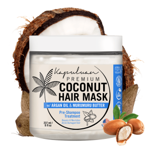 A jar of Coconut Hair Food w/ Shea and Babassu for pre-shampoo treatment comes in an 8 fl oz container, featuring a background with a coconut and murumuru seeds, along with various certifications.