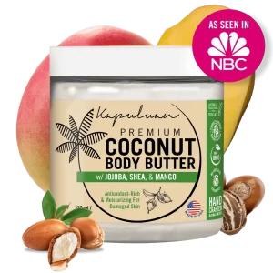 A labeled jar of Body Butter w/ Jojoba Oil, Shea, & Mango is shown against a transparent background. The jar is surrounded by shea nuts, a mango, and the NBC logo, indicating it was featured on NBC. The body butter is marketed as antioxidant-rich and moisturizing for damaged skin.