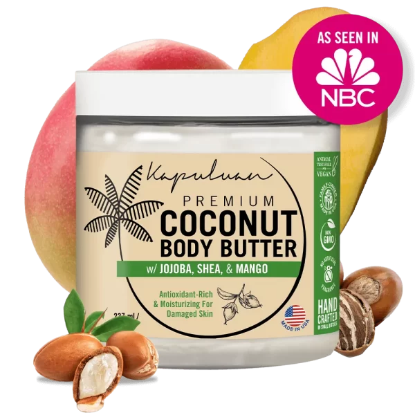 A labeled jar of Body Butter w/ Jojoba Oil, Shea, & Mango is shown against a transparent background. The jar is surrounded by shea nuts, a mango, and the NBC logo, indicating it was featured on NBC. The body butter is marketed as antioxidant-rich and moisturizing for damaged skin.