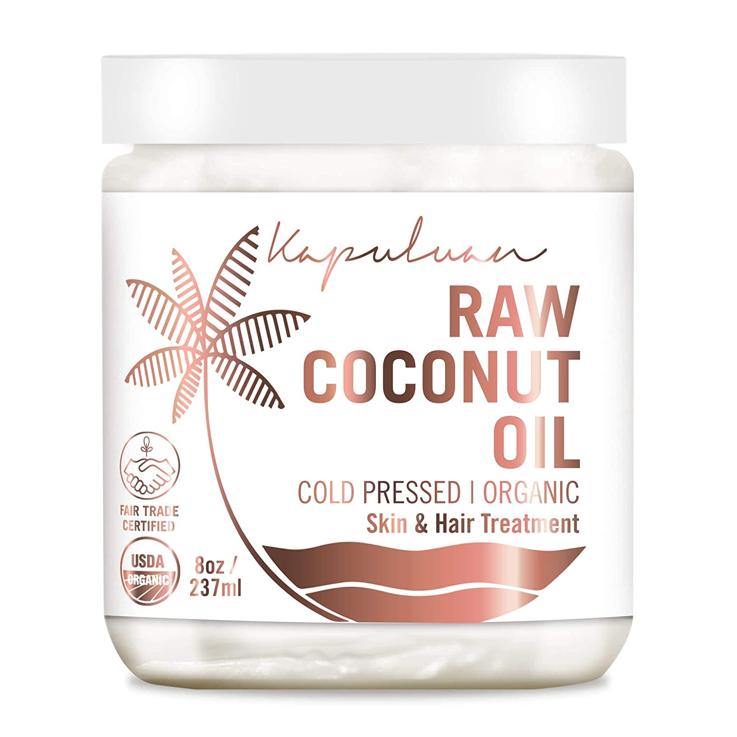 Jar of organic raw coconut oil for coconut skin and hair treatment, cold-pressed and fair trade certified.