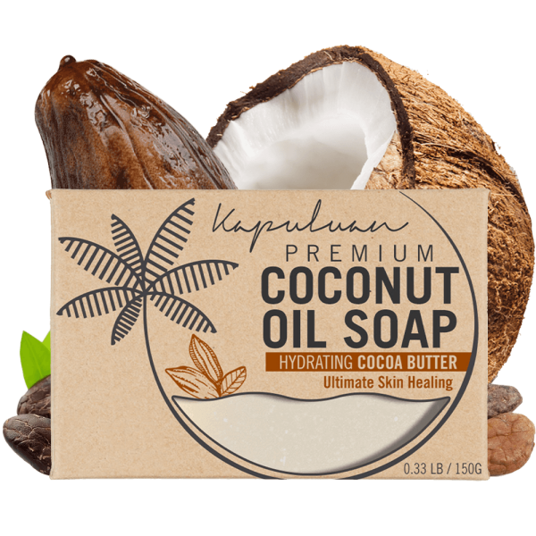 A bar of Coconut Oil Soap with Exfoliating Oatmeal, featuring hydrating cocoa butter, displayed with a cracked coconut and cocoa pod. The packaging emphasizes its ultimate skin healing benefits.