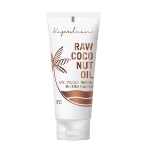 A white tube of Kapuluan Raw Coconut Oil, labeled as cold pressed and natural, suitable for skin and hair treatment. The packaging features a brown coconut tree graphic and text, with a net weight of 100 ml (3.4 fl oz).