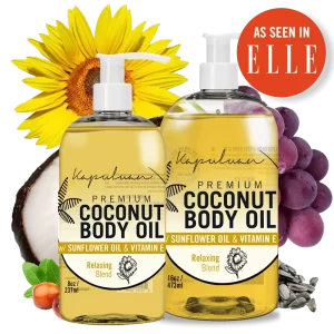 Two clear bottles labeled "Relaxing Coconut Body Oil" with Sunflower Oil and Vitamin E. Bottles are 8 oz and 16 oz sizes. Background features a sunflower, coconut, grapes, and sunflower seeds. An “As Seen in ELLE” badge is at the top right. Packaging reads "Relaxing Blend.