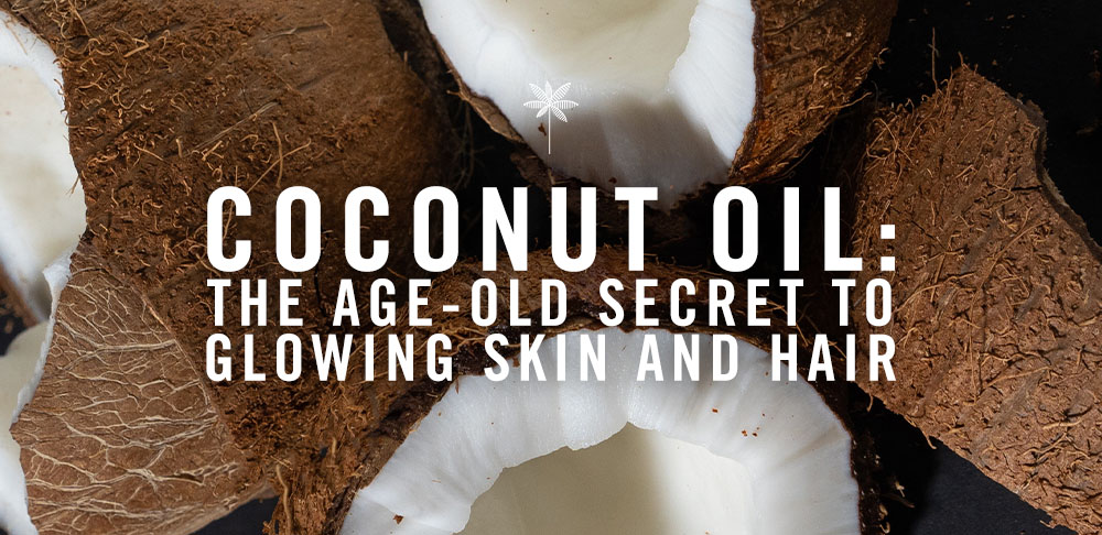 Promotional image featuring fresh coconuts surrounded by coconut oil text overlay reading "coconut oil: the age-old secret to glowing skin and hair" on a dark background.