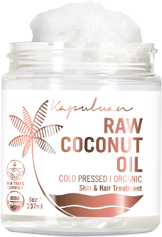 A clear jar of kapuluan raw coconut oil, labeled as "cold pressed organic," intended for skin and hair treatment, with a stylized fern leaf design. the logo and usda organic seal are visible.