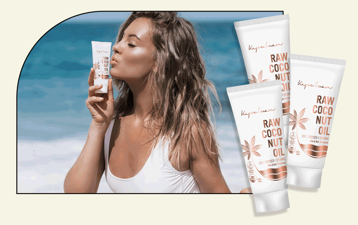A woman in a white top holds and gazes at a tube of raw coco nut sunblock, flanked by multiple sunblock tubes on a beach-themed backdrop.