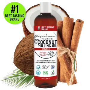 A bottle of Coconut Pulling Oil - Cinnamon is shown. It is labeled as the "#1 Best Tasting Brand". Surrounding the bottle are a whole coconut, a cut coconut, cinnamon sticks, and palm leaves. The bottle's labels highlight various benefits.