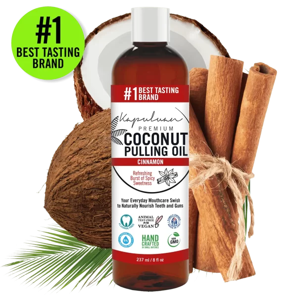 A bottle of Coconut Pulling Oil - Cinnamon is shown. It is labeled as the "#1 Best Tasting Brand". Surrounding the bottle are a whole coconut, a cut coconut, cinnamon sticks, and palm leaves. The bottle's labels highlight various benefits.