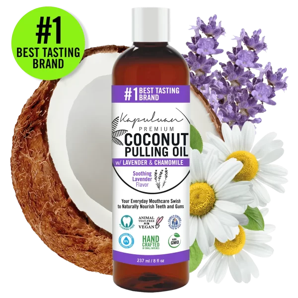 A bottle of Coconut Pulling Oil - Soothing Lavender is displayed against a background featuring a split coconut, lavender flowers, and chamomile flowers. The label highlights that it is handcrafted, non-GMO, and vegan.